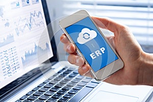 ERP app on smartphone screen connecting data with cloud computing