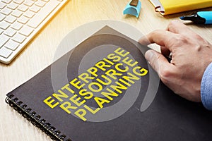 ERP Enterprise Resource Planning book on table.