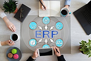 ERP enterprise resource planning business automation technology on office desktop.