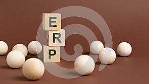 ERP - Enterprise Resource Planning - letter pices on the wooden cubes, white background