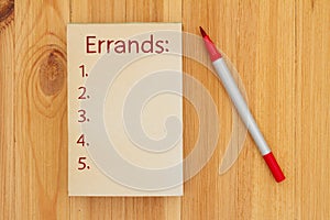 Errands list on retro old paper notepad with marker