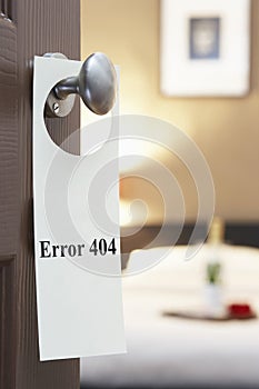 Error 404' sign on hotel room door