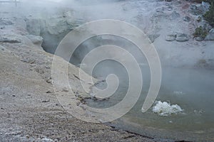 Errupting geyser in pool, Yellowstone
