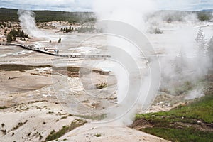 Erupting geysers and hot springs and thermal features in Norris Geyser Basin