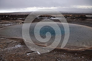 The eruption of the Strokkur geyser in the southwestern part of Iceland in a geothermal area near the river Hvitau