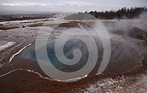 The eruption of the Strokkur geyser in the southwestern part of Iceland in a geothermal area near the river Hvitau