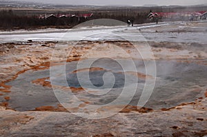 The eruption of the Strokkur geyser in the southwestern part of Iceland in a geothermal area near the river Hvitau