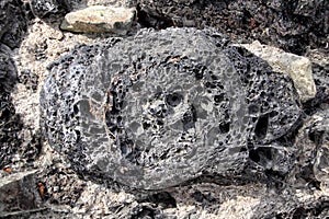 Eruptive stone implemented in the wall