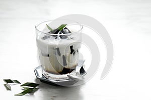 Es Cincau Hitam or Black Grass Jelly Cincau Hitam, Indonesian Dessert Made from Cincau Leaf with Coconut Milk and Palm Sugar
