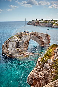 Es Pontas rock arch at Mallorca coast, Spain photo