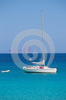 Es Vedra background with sailboat from Formentera