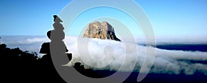 Es Vedra covered with cloud blanket photo