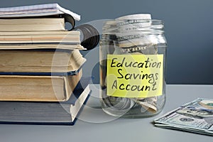 ESA Education Saving Account label on jar with money and books