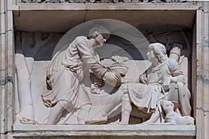 Esau selling his birthright to Jacob, marble relief on the facade of the Milan Cathedral