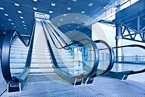 Escalator in blue corridor