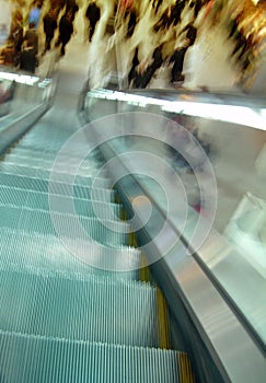 Escalator and blurry crowd movement