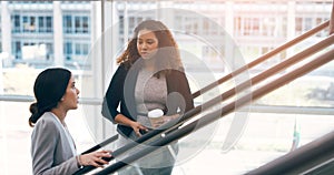 Escalator, discussion and business women in office for arrival in lobby for work, job and career. Modern building