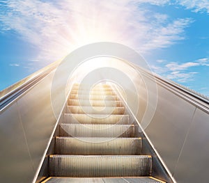 Escalator going forward fading into the sky