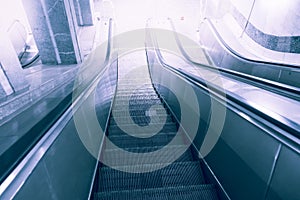 Escalator, up and down escalators in public building or subway