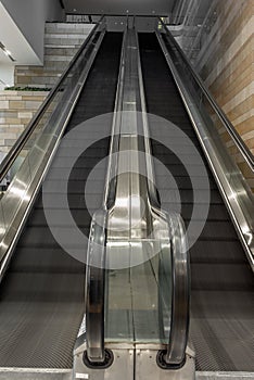 Escalators in an empty shopping mall in Hong Kong with motion bl