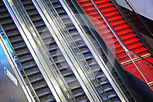 Escalators and red stairs at the airport