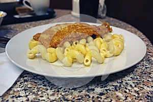 Escalope with pasta on a plate