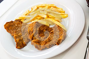 Escalope served with fried potato