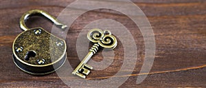 Escape room concept, vintage golden key and opened padlock, web banner
