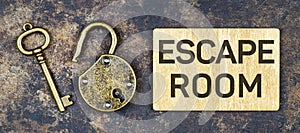 Escape room game concept, old vintage key and padlock photo