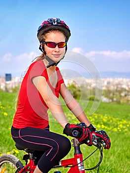 Escape urban . Bicycle girl wearing helmet rest from city urbanization.