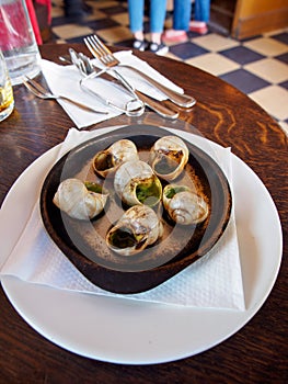 Escargot snails in French cafe, Paris, France, vertical