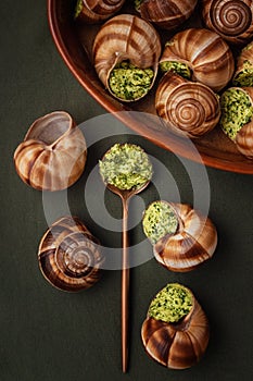 Escargots baked in green butter sause