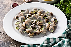 Escargots de Bourgogne on wooden table