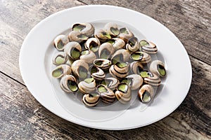 Escargots de Bourgogne on wooden table