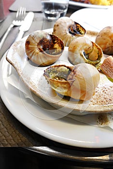 Escargots snails in french restaurant cafe photo