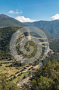 Escarpment and river valley at Patrimonio in Corsica photo