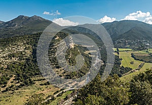 Escarpment and river valley at Patrimonio in Corsica photo