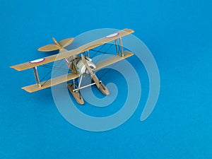 Escort fighter scale miniature, copy space. WWI Model Biplane. Concept of hobby, scale model building, aviation