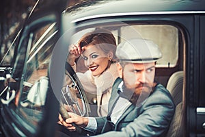 Escort of girl by security. escort concept with bearded driver and luxury girl in retro car.