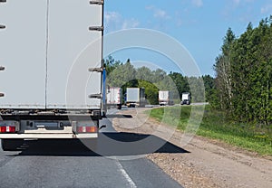 escort of trucks on road