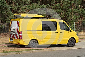 Escort vehicle with the sign Heavy transport at the rear