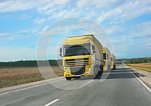 Escort of yellow trucks