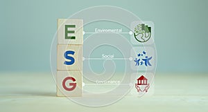 ESG concept of environmental, social and governance. Sustainable corporation development. Wooden cubes with abbreviation ESG stan