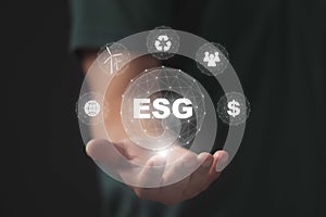 ESG concept in the hand for environmental, social, and governance in sustainable on the Network connection