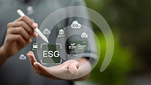ESG digital interface with CO2 and environmental icons on hand
