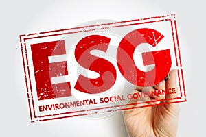 ESG Environmental Social Governance acronym - evaluation of a firms collective consciousness for social and environmental photo