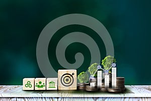 ESG icon concept in cube blocks and coin, graph, tree, for environmental, social, and governance in sustainable and ethical