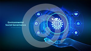 ESG icon in wireframe hand. Environmental Social Governance concept on virtual screen. Future environmental conservation and ESG