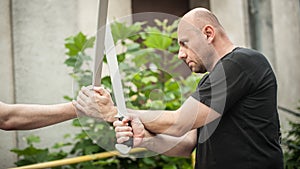 Eskrima and kapap instructor demonstrates machete weapon fighting technique