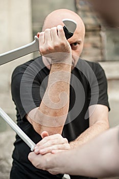 Eskrima and kapap instructor demonstrates machete weapon fighting technique